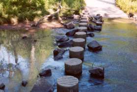 After a short distance the trail crosses Sugarland Run on columns.