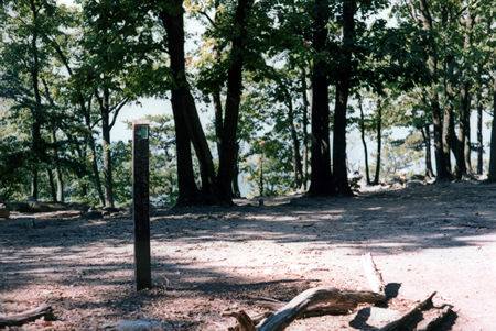 The red trail intersects with the green trail near the top of the summit at this post.