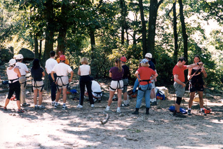 The group shown are getting instructions on rqppelling down a nearby cliff.