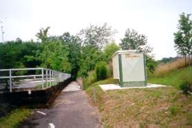 This path is between the Landmark Arboretum grounds and the Herndon/Monroe bus terminal.