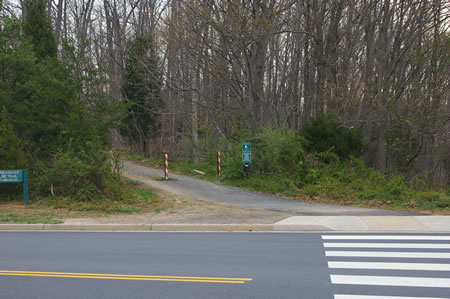 Cross Twin Branches Rd at Glade Dr and take the  road shown up the slight rise.