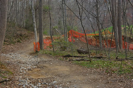 The trail crosses a retention basin. Part of the dam eroded during a severe storm in June 2006.