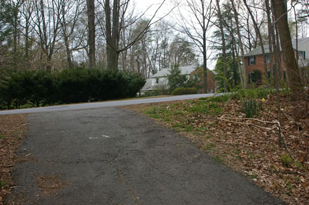 The trail intersects with Cross School Rd. Cross that road and walk a short distance down the intersecting  Midsummer Dr.