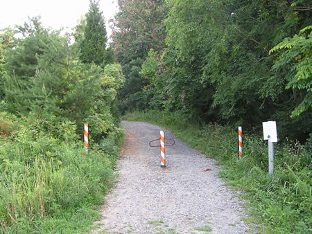 The trail starts on the east side of Twin Branches Rd. opposite Glade Dr.