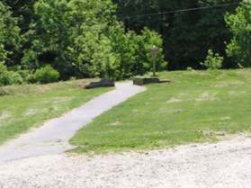 Take the asphalt path leading from the parking area with the train station on the left.